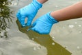 Taking a water test for analysis from a reservoir. Royalty Free Stock Photo