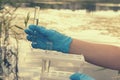 Taking a water test for analysis from a reservoir. Royalty Free Stock Photo