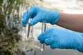 Taking a water test for analysis from a reservoir. Royalty Free Stock Photo