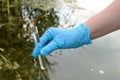 Taking a water test for analysis from a reservoir. Royalty Free Stock Photo