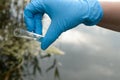 Taking a water test for analysis from a reservoir. Royalty Free Stock Photo