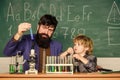 Taking You Forward. small boy with teacher man. Biologist Conducts Experiments by Synthesising Compounds. Back to school