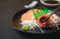 Tako sashimi on chopsticks, Japanese food
