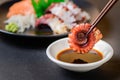 Tako sashimi on chopsticks, Japanese food