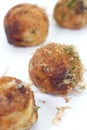 Takoyaki , ball - shaped Japanese snack