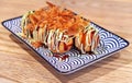 Takoyaki is a ball-shaped Japanese snack made of a wheat flour-based batter and cooked in a special molded pan. Dish from Japan