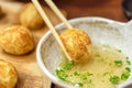 Takoyaki, delicious fried squid ball usually a street food in Japan. Japanese snack eating with hot soup for Himeji region Royalty Free Stock Photo