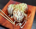 Takoyaki octopus balls on wooden plate. Japanese Food Royalty Free Stock Photo