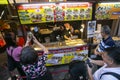 Takoyaki Restaurant in Dontonbori district with tourists. Royalty Free Stock Photo