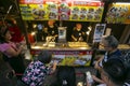 Takoyaki Restaurant in Dontonbori district with tourists. Royalty Free Stock Photo