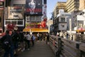 Takoyaki Restaurant in Dontonbori district with tourists. Royalty Free Stock Photo