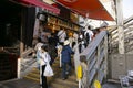 Takoyaki Restaurant in Dontonbori district with tourists. Royalty Free Stock Photo