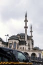 Taksim Mosque in Istanbul, Turkey and a Black Taxi in front