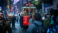 Taksim Tunel Nostalgia Tram drives along istiklal street and people at istiklal avenue, Turkey