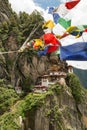 Taktsang Palphug Monastery with prayer flag (also known as The Tiger nest temple), Paro, Bhutan Royalty Free Stock Photo