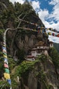 Taktsang Palphug Monastery with prayer flag (also known as The Tiger nest temple), Paro, Bhutan Royalty Free Stock Photo