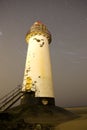 Talacre lighthouse at night with star trails Royalty Free Stock Photo