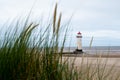 Talacre lighthouse, North Wales shot at dusk with dune grass in the foreground Royalty Free Stock Photo