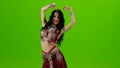 Talanted belly dancer in red dress. Green screen. Slow motion