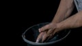 Talc sports. Closeup of a muscular man ready to workout. male powerlifter hand in talc and sports wristbands preparing