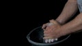 Talc sports. Closeup of a muscular man ready to workout. male powerlifter hand in talc and sports wristbands preparing