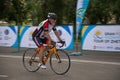 TALDYKORGAN, KAZAKHSTAN - MAY 21, 2017: An elderly male athlete rides a road bike