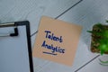 Talent Analytics write on sticky notes isolated on Wooden Table Royalty Free Stock Photo