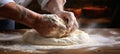 Talented baker skillfully kneading dough for baking fresh bread in a vibrant bakery, bright photo Royalty Free Stock Photo