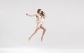 Talented ballet dancer in athletic jump