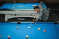 talented billiard player poking the white ball during the game Royalty Free Stock Photo