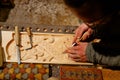 Skilled Carpenter Carving Intricate Designs on Wood for Artisanal Creations Royalty Free Stock Photo