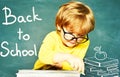 Talented child. Blackboard background. First school day. Kids school. Hard exam. Cheerful smiling child at the