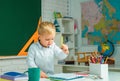 Talented child. Teachers day. School kids. Back to school. Kid is learning in class on background of blackboard. Royalty Free Stock Photo