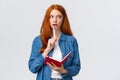 Talented, creative good-looking redhead woman writing poem, story, taking notes, prepare grocery list, gasping recall Royalty Free Stock Photo