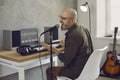 Musician singing and playing music on MIDI keyboard in his home recording studio Royalty Free Stock Photo