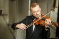 Talented gorgeous man play violin Royalty Free Stock Photo