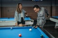 talented male pool player poking the white ball from his back Royalty Free Stock Photo