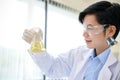 Talented male scientist or medical doctor specialist holding an Erlenmeyer flask Royalty Free Stock Photo