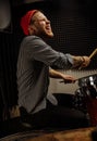 Talented musician play on drums and sing Royalty Free Stock Photo