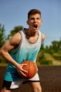 Talented skilled teenager boy basketball player portrait