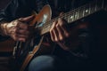 Talented unrecognizable male artist African-American musician close up male hands playing guitar fingers touching Royalty Free Stock Photo