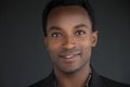 Vibrant Close-Up Portrait of a Talented Young African Comedian on Black Background