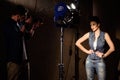 Talented young man photographing girl in studio Royalty Free Stock Photo