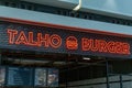 Talho Burger neon sign restaurant logo. Talho translated in English: Butcher Royalty Free Stock Photo