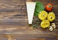 talian food ingredients: pasta, tomato, spinach, pepper, porcini on wooden background Royalty Free Stock Photo