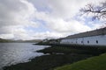 The Talisker distillery and Loch Harport on the Isle of Skye Royalty Free Stock Photo