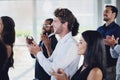 That talk is deserving of a standing ovation. Cropped shot of a group of businesspeople applauding during a seminar in Royalty Free Stock Photo