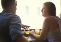 Talk, happy couple and drinking beer in pub, relax and leisure together in restaurant with alcohol. Smile, man and woman Royalty Free Stock Photo