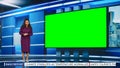 Talk Show TV Program: Beautiful Black Female Presenter Standing in Newsroom Studio, Uses Big Green