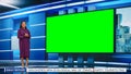 Talk Show TV Program: Beautiful Black Female Presenter Standing in Newsroom Studio, Uses Big Green